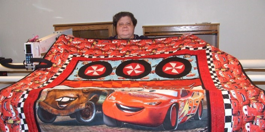 APQS Giveaway Winner Cindy K with Cars Quilt