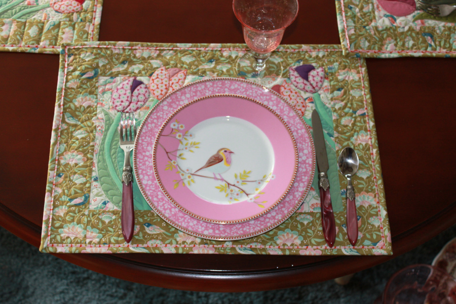 A place setting with a "Springtime tulip" placemat.