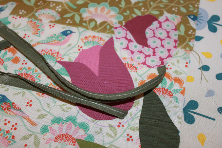 Connecting a bias cut fabric strip to the base of a tulip head.