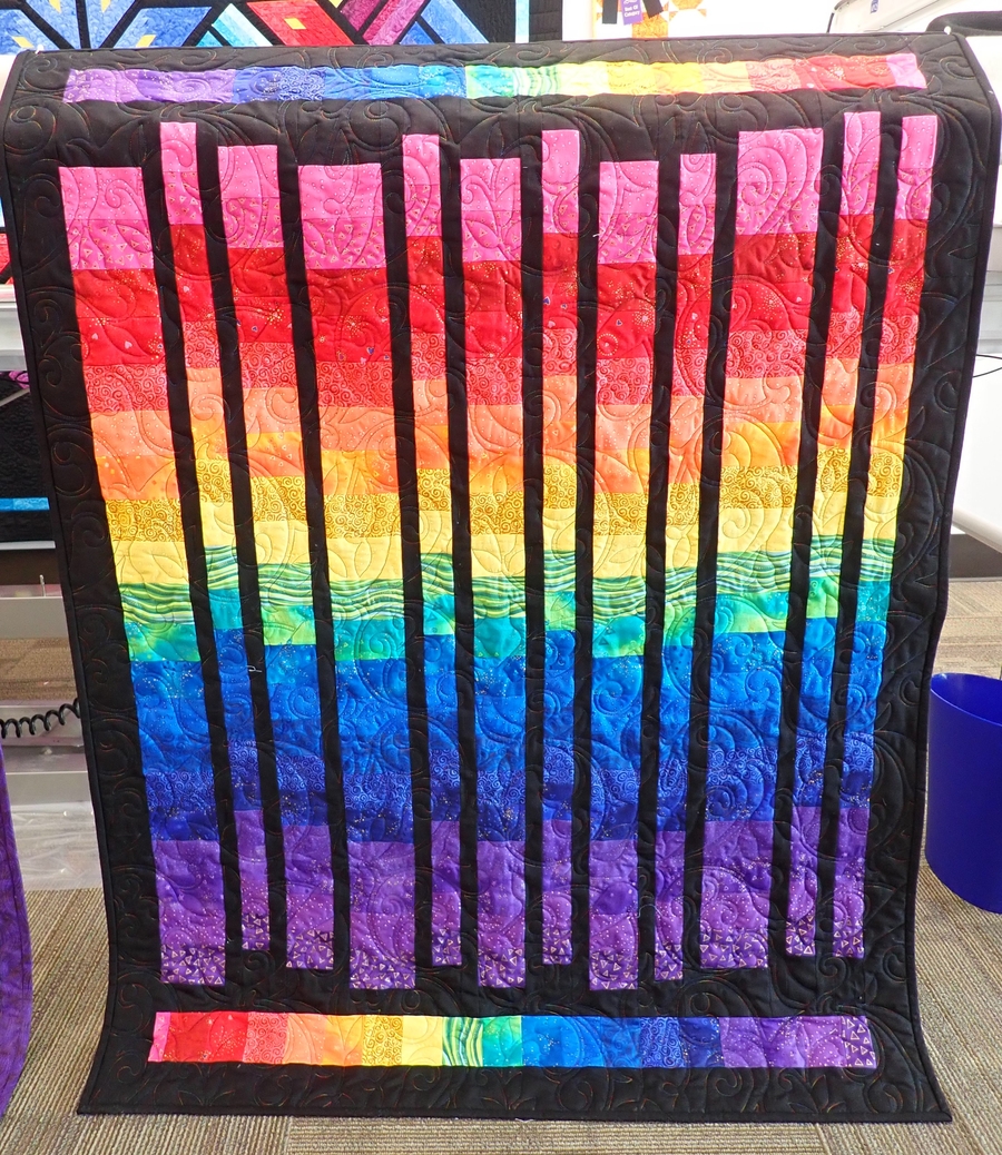 Completed rainbow Stripped Ease quilt