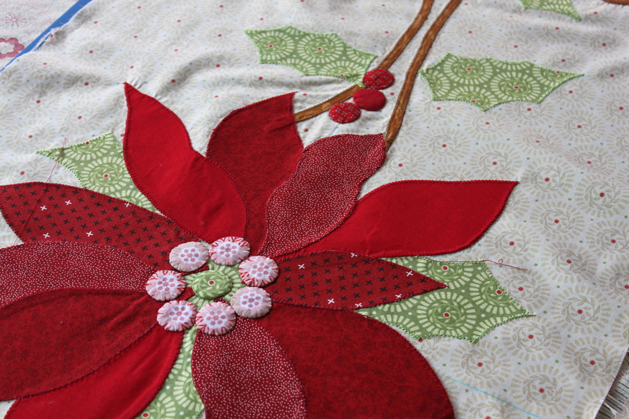 red fabric placed in a flower pattern with applique 