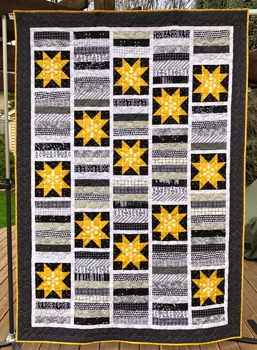 a photo of the complete daffodil punch quilt