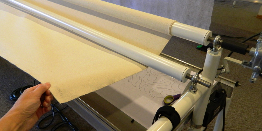 Loading a quilt on your longarm quilting machine - attaching the backing fabric on a quilt