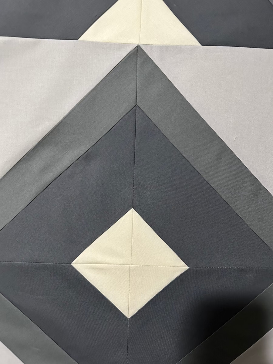 Quick Quilt Top – Half Square Triangle Block: Help us pick a quilting design - zoomed in image of half square triangle block quilt top
