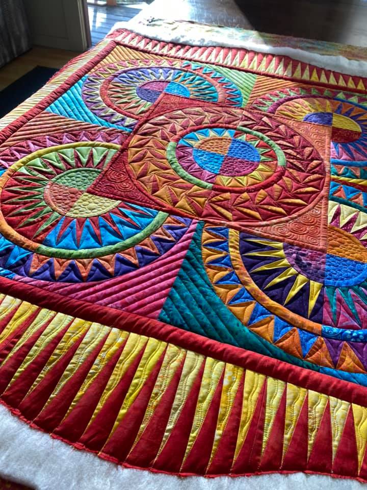How to take high-quality photographs of your quilt - image of colorful quilt on display