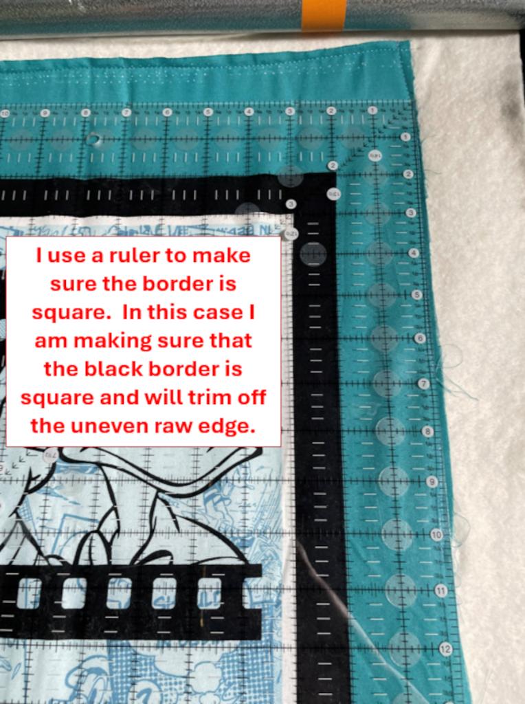 Keeping your quilt square - demonstrating how to use the ruler for the border